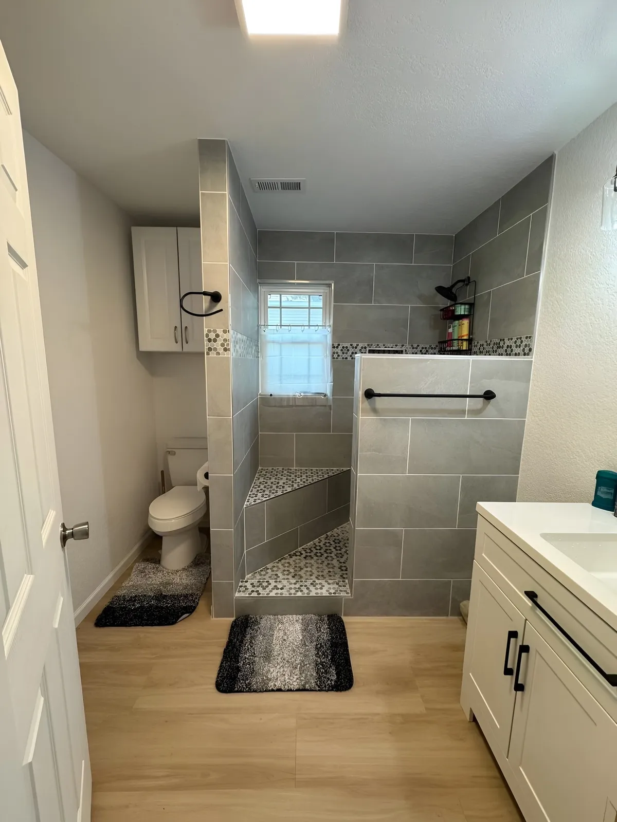 Finished bathroom with tiled walk-in shower